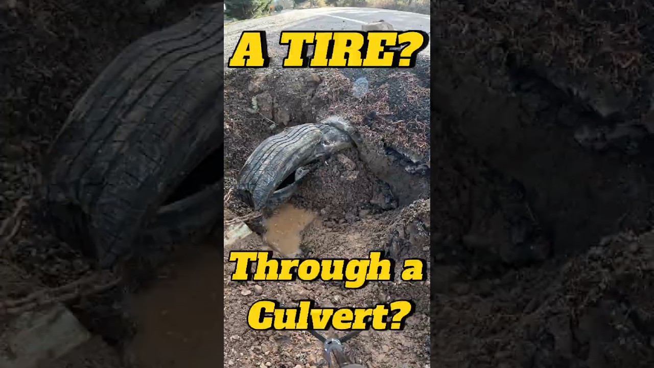 Using a tire to clean out a culvert