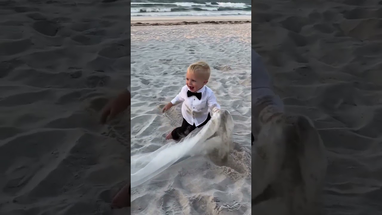 Ring Baby Yells 'I GOT IT!' Dives to Save Bride's Veil at Beach Wedding 🌊👰