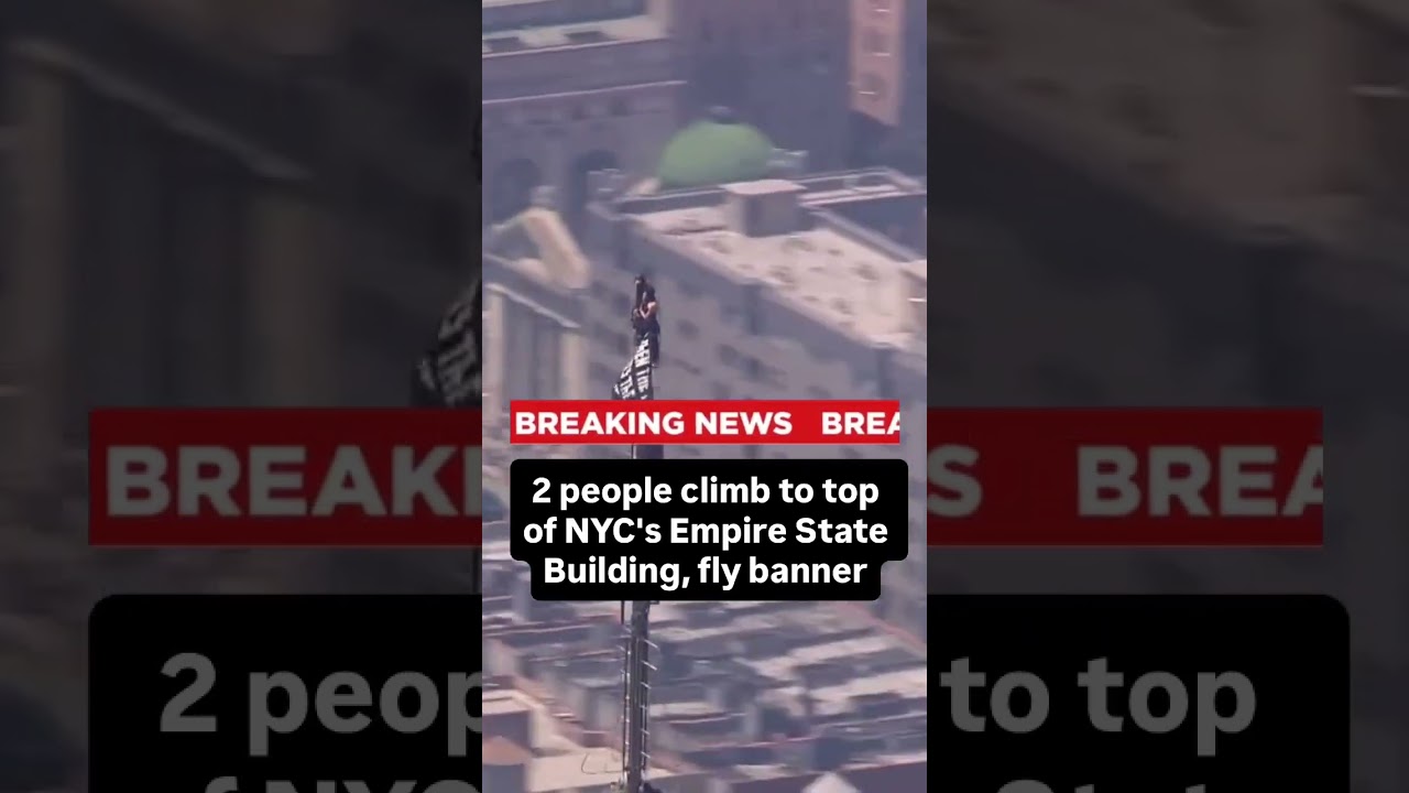 2 people climb to top of NYC's Empire State Building, fly banner