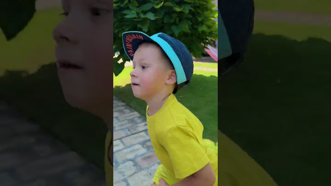 Brotherly Love: Sharing Hats on a Hot Summer Day 🧢 ☀️