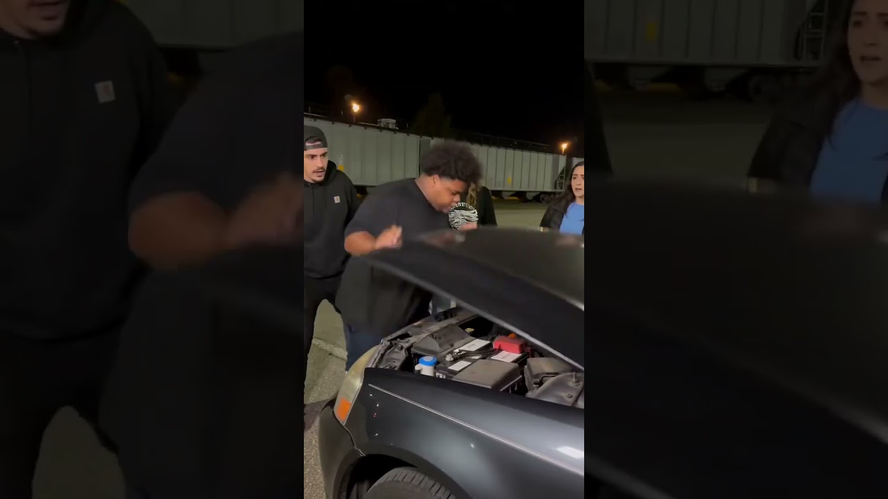 THE WHOLE GROUP STOPPED WHEN HE REACHED INTO THE ENGINE