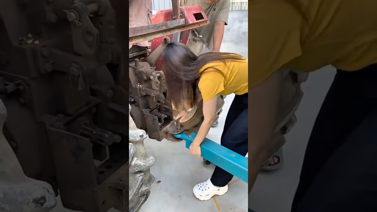 a mulher que trabalha na roça é muito forte e puxa sozinha o trator para por a carreta