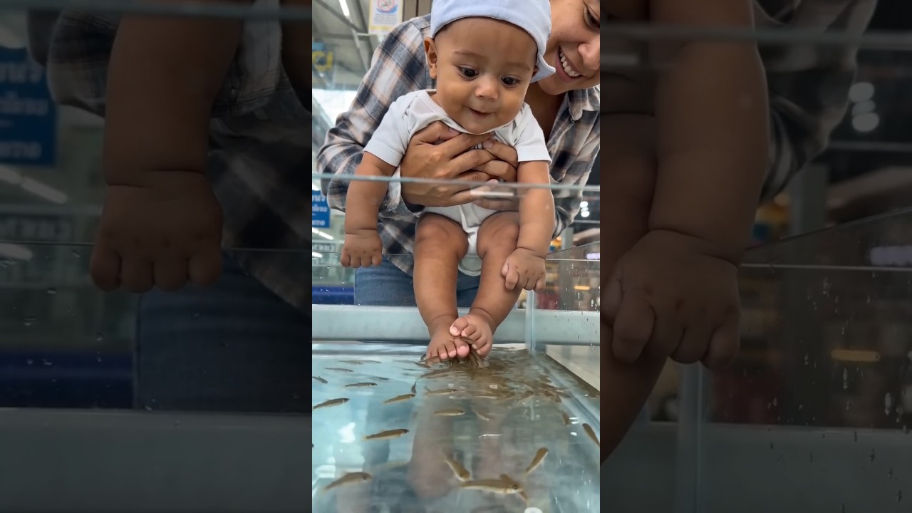 Trying fish pedicure abroad and he's fascinated 🥹🐠 #viralvideo #babyfishspa #cutebaby #shortsfeed
